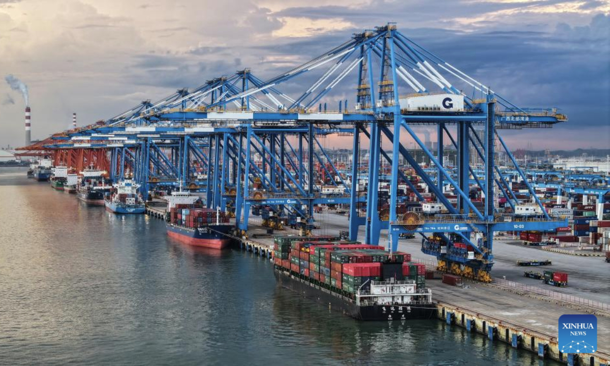 A drone photo taken on Sept. 16, 2025 shows a view of the Qinzhou Port in Qinzhou City, south China's Guangxi Zhuang Autonomous Region. As of August 2025, the New International Land-Sea Trade Corridor has expanded its reach to 577 ports in 127 countries and regions, handling over 1,316 product categories. (Xinhua/Zhang Ailin)