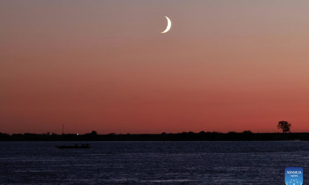 A crescent moon is seen in the sky over Fuyuan, Jiamusi City of northeast China's Heilongjiang Province, Sept. 26, 2025. (Photo by Li Yongjun/Xinhua)