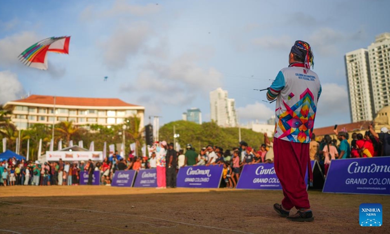 A man manipulates a kite at the Colombo International Kite Festival in Colombo, Sri Lanka, Aug. 24, 2025. (Xinhua)