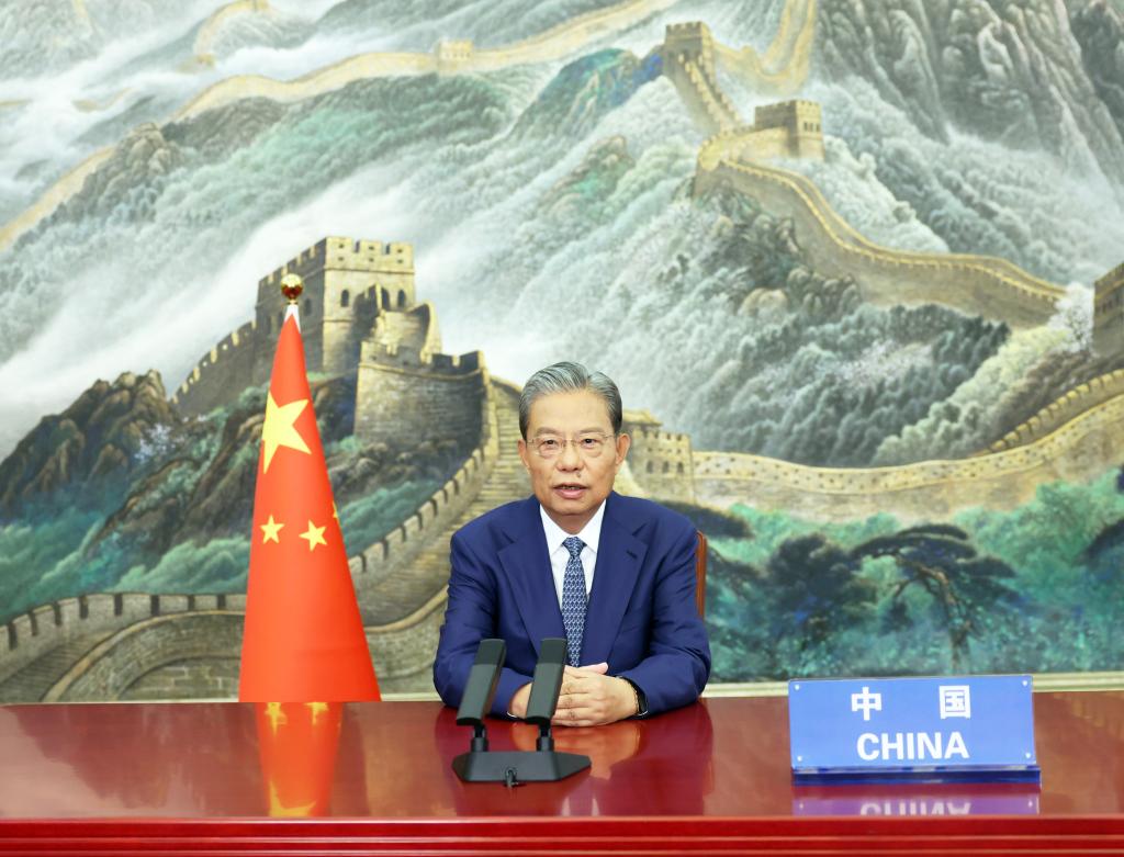 Zhao Leji, chairman of the National People's Congress Standing Committee, makes remarks in a video address delivered to the second meeting of parliamentary leaders of the Group of Friends of Neutrality member states, at the invitation of Dunyagozel Gulmanova, chairperson of the National Assembly (Mejlis) of Turkmenistan, Oct. 8, 2025. (Xinhua/Liu Weibing)
