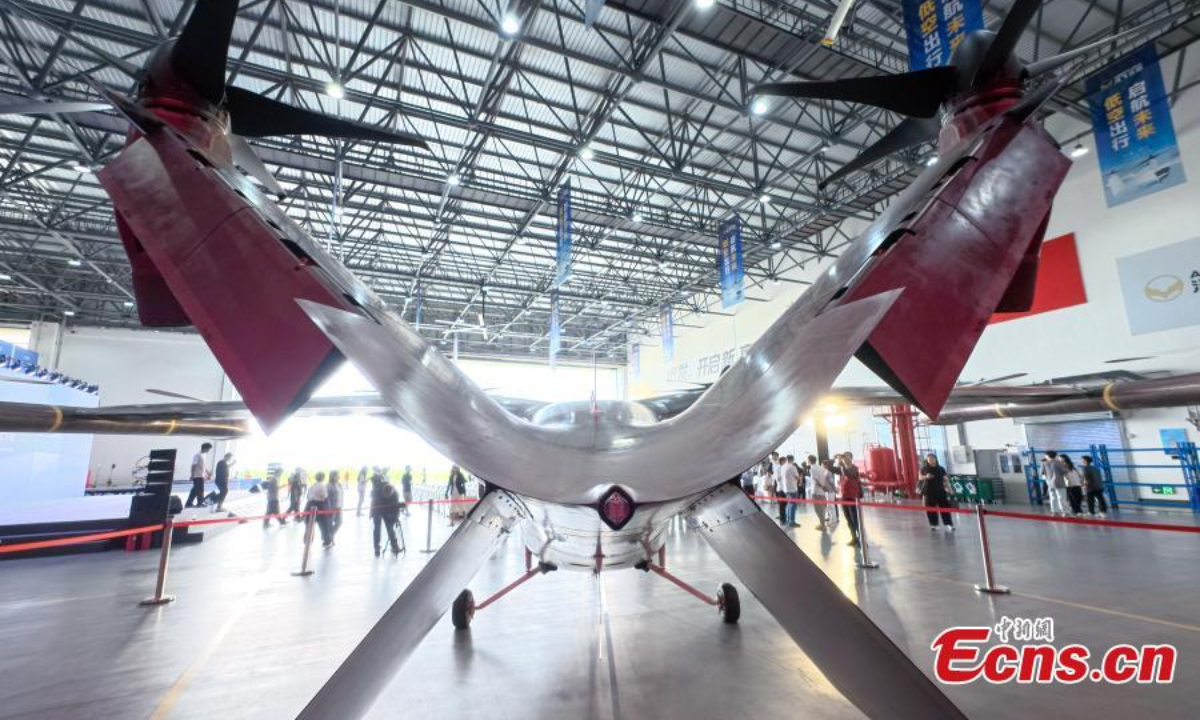 China's first domestically-developed large passenger-carrying eVTOL (electric vertical take-off and landing aircraft) model AE200-100, designed for low-altitude travel, rolls off the assembly line in Chengdu City, Sichuan Province on Sep 29, 2025. Photo:China News Service