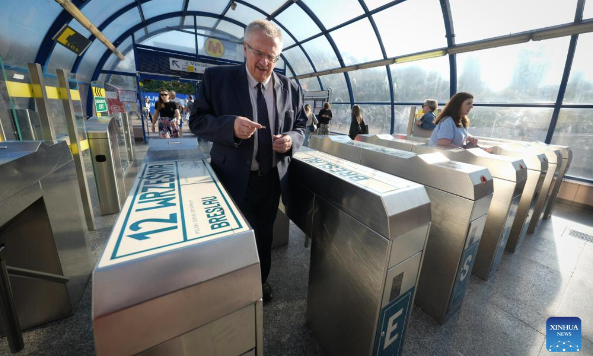 Passengers enter through ticket gates at a central metro station in Warsaw, Poland on Sept. 22, 2025. Public transportation in Warsaw was free of charge for all passengers on World Car Free Day, part of the European Mobility Week to promote sustainable urban mobility. (Photo by Jaap Arriens/Xinhua)