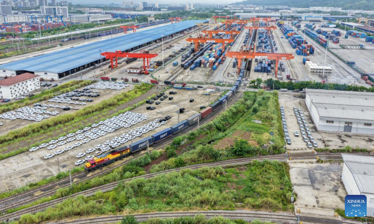 A drone photo taken on Sept. 8, 2025 shows a China-Europe freight train departing from the Tuanjiecun Station in southwest China's Chongqing. From January to July this year, the China-Europe freight train from southwest China's Chengdu and Chongqing has made over 3,400 trips, transporting more than 280,000 twenty-foot equivalent units (TEUs) of import and export goods. (Xinhua/Tang Yi)