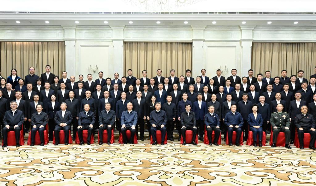 Chinese President Xi Jinping, also general secretary of the Communist Party of China Central Committee and chairman of the Central Military Commission, poses for a group photo while meeting with representatives of cadres who come to work in Xinjiang from other parts of the country in Urumqi, northwest China's Xinjiang Uygur Autonomous Region, Sept. 23, 2025. (Xinhua/Shen Hong)