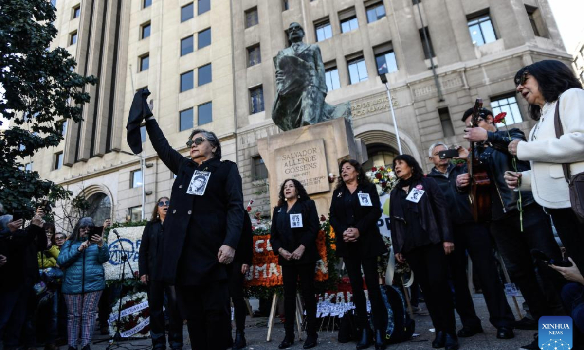 People attend an event to pay homage to former Chilean President Salvador Allende and to commemorate the 52nd anniversary of the military coup against Allende, near La Moneda Palace in Santiago, capital of Chile, Sept. 11, 2025. Then-Commander-in-chief of the Chilean army Augusto Pinochet launched a military coup to overthrow the democratically-elected government of Allende on Sept. 11, 1973. Allende was killed during the coup, marking the beginning of a 17-year period of military regime in Chile. (Photo by Jorge Villegas/Xinhua)