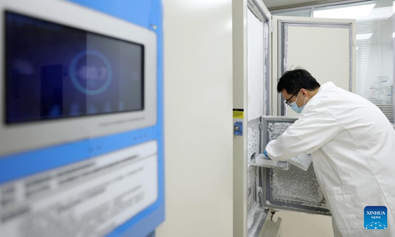 A researcher works at the National Conservation and Research Center for Milu, at Milu Park in Beijing, capital of China, Aug. 18, 2025. (Xinhua)