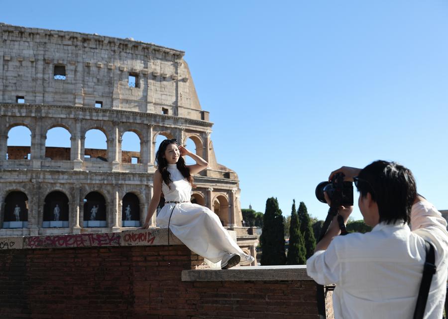 A Chinese tourist poses for a photo at the Colosseum in Rome, Italy, Oct. 6, 2025. (Xinhua/Li Jing)