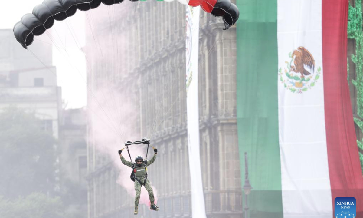 A paratrooper lands at the Zocalo Square during an Independence Day military parade in Mexico City, Mexico, Sept. 16, 2025. (Photo by Francisco Canedo/Xinhua)