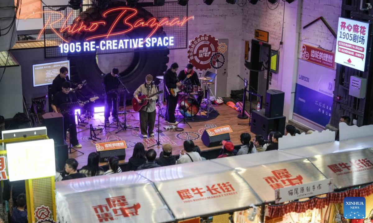 Citizens watch a live show at 1905 Art Re-Creative Space, which is transformed from an abandoned factory, in Shenyang, capital of northeast China's Liaoning Province, Oct. 6, 2025. Many industrial heritages in Shenyang of northeast China's Liaoning Province have been transformed into public leisure spaces, creative industry parks, and distinctive neighborhoods, offering citizens and tourists unique experiences during this year's National Day and Mid-Autumn Festival holiday. (Xinhua/Pan Yulong)