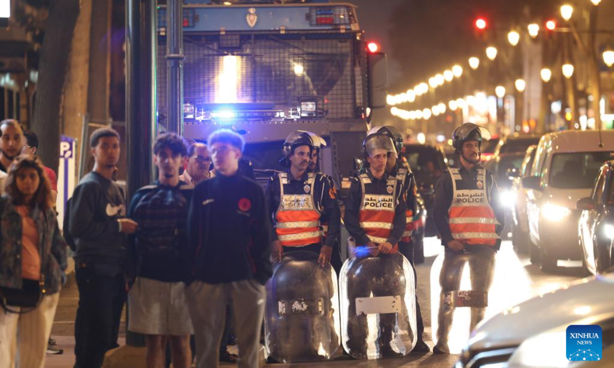 Security forces stand guard at a crossroad during a demonstration demanding for better public services in downtown Rabat, Morocco, Oct. 2, 2025. Three people were killed during youth-led protests near Morocco's Atlantic coastal city of Agadir, the Moroccan Interior Ministry said Thursday. Despite the government's pledges, protests that began across Morocco on Saturday have continued. Protesters have demanded major reforms in education and healthcare, criticizing the government for prioritizing spending on international sporting events such as the 2030 FIFA World Cup and the 2025 Africa Cup of Nations instead of improving public services. (Xinhua/Huo Jing)