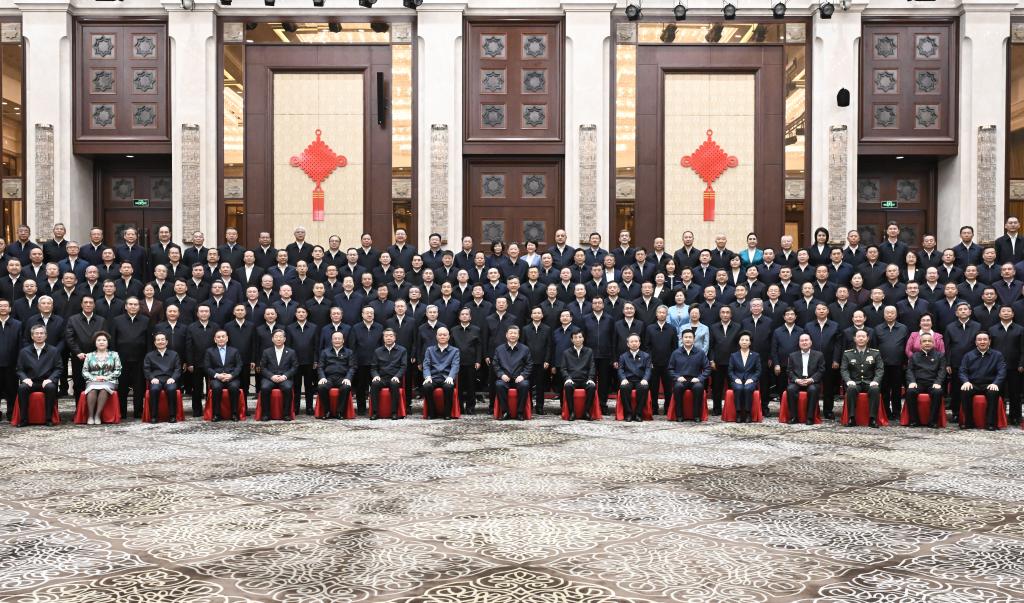 Chinese President Xi Jinping, also general secretary of the Communist Party of China Central Committee and chairman of the Central Military Commission, poses for a group photo while meeting with representatives of local officials at various levels and from various departments in Urumqi, northwest China's Xinjiang Uygur Autonomous Region, Sept. 23, 2025. (Xinhua/Yan Yan)