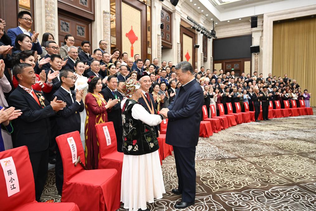 Chinese President Xi Jinping, also general secretary of the Communist Party of China Central Committee and chairman of the Central Military Commission, meets with representatives from all ethnic groups and all walks of life in northwest China's Xinjiang Uygur Autonomous Region, in Urumqi, the regional capital, Sept. 23, 2025. (Xinhua/Xie Huanchi)