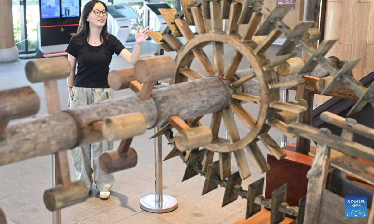A staff member introduces a traditional water lift at an exhibition hall of the Chishan Lake Irrigation System in Jurong City, east China's Jiangsu Province, on Sept. 15, 2025. The 17-century-old Chishan Lake Irrigation System has recently been added to the World Heritage Irrigation Structures (WHIS) list during the 76th International Executive Council Meeting of the International Commission on Irrigation & Drainage (ICID). The system is still nourishing more than 5,100 hectares of arable lands. (Xinhua/Ji Chunpeng)