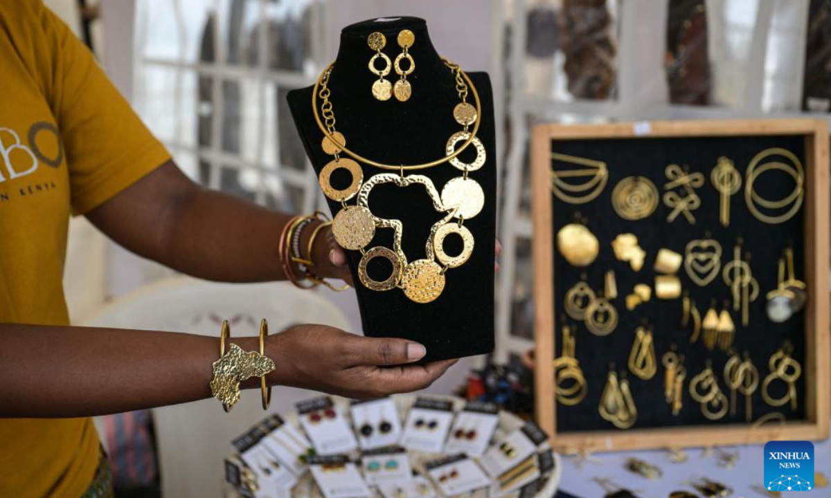 An exhibitor displays African-style jewelry at the 15th edition of the Magical Kenya Travel Expo in Nairobi, Kenya, Oct. 2, 2025. Kenya is hosting the three-day expo, running until Friday, which has attracted 6,500 delegates from 40 countries, including tourism ministers, city mayors, investors, travel enthusiasts, and promoters. (Xinhua/Yang Guang)