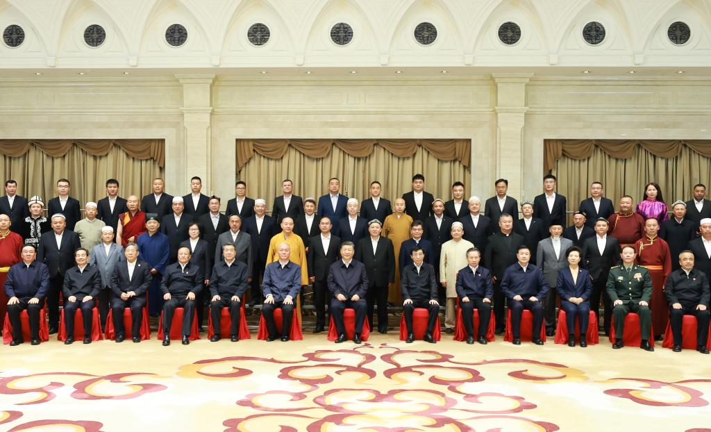 Chinese President Xi Jinping, also general secretary of the Communist Party of China Central Committee and chairman of the Central Military Commission, poses for a group photo while meeting with representatives of patriotic members of the religious circles in Urumqi, northwest China's Xinjiang Uygur Autonomous Region, Sept. 23, 2025. (Xinhua/Ding Lin)