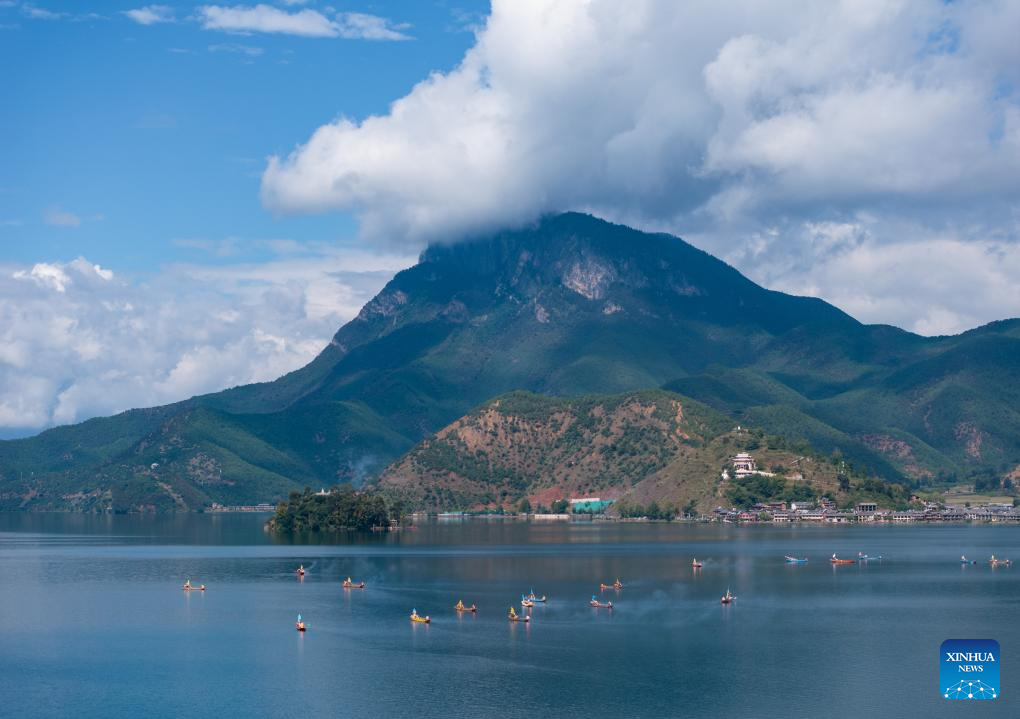 An aerial drone photo taken on Sept. 16, 2025 shows local people circling the lake by boat in Yanyuan County of Liangshan Yi Autonomous Prefecture, southwest China's Sichuan Province. The first mountain and lake circling festival of Lugu Lake kicked off at Liangshan Yi Autonomous Prefecture on Tuesday. Mountain and lake circling is an important folk custom of the Mosuo people living near Lugu Lake. Starting this year, Liangshan Prefecture has officially designated the 25th day of the seventh lunar month as the mountain and lake circling festival, making it a local statutory holiday. Residents of Yanyuan and Muli counties can enjoy a one-day exclusive holiday. (Xinhua/Jiang Hongjing)