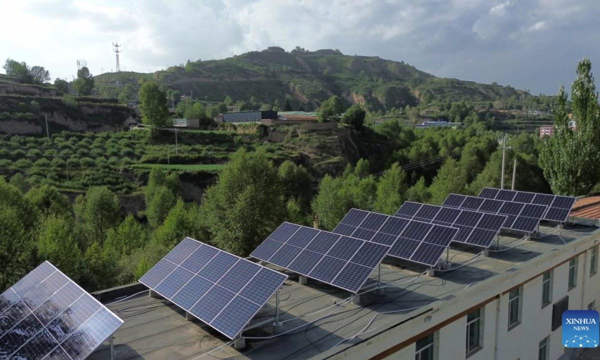 Rooftop solar panels are pictured in Huzhu Tu Autonomous County, northwest China's Qinghai Province, on Aug. 8, 2025.(Xinhua)