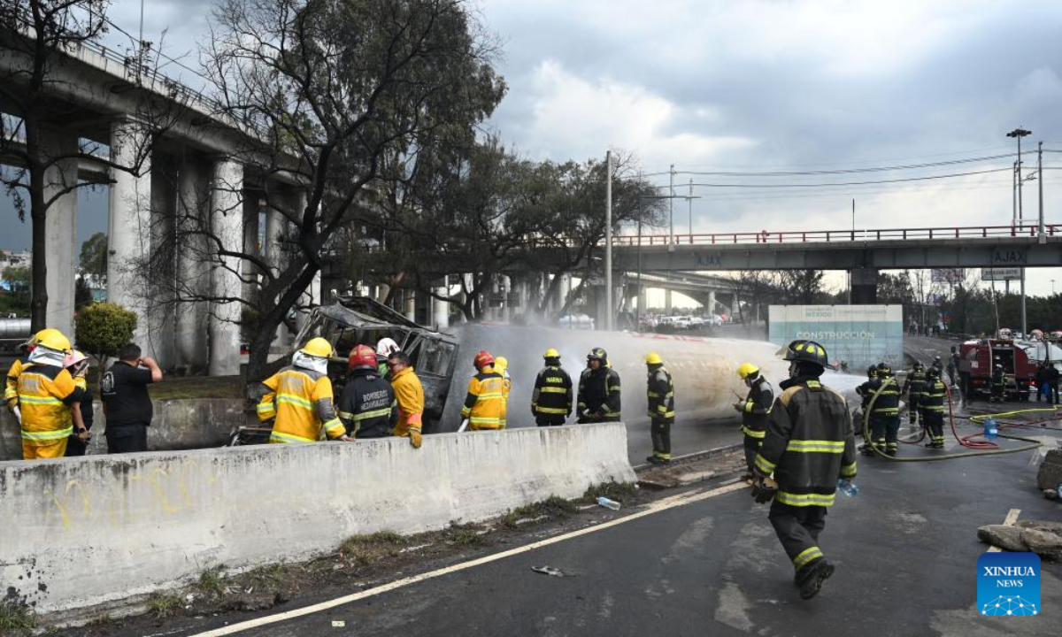 Firefighters work at the gas tanker truck explosion accident site in Mexico City, Mexico, Sept. 10, 2025. Fifty-seven people were injured after a gas tanker truck exploded on Wednesday in Mexico City, with 19 of them in serious condition, local authorities said. (Str/Xinhua)