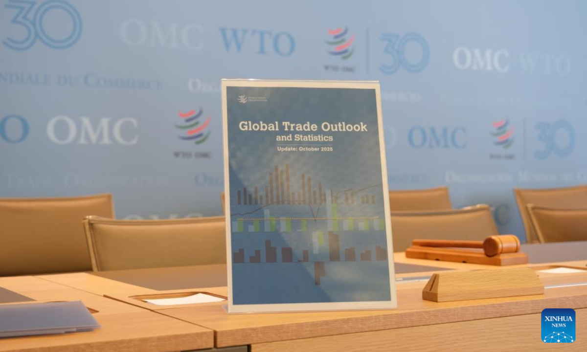 The cover of the World Trade Organization (WTO)'s latest Global Trade Outlook and Statistics report is pictured at the WTO headquarters in Geneva, Switzerland, Oct. 7, 2025. (Xinhua/Ma Ruxuan)