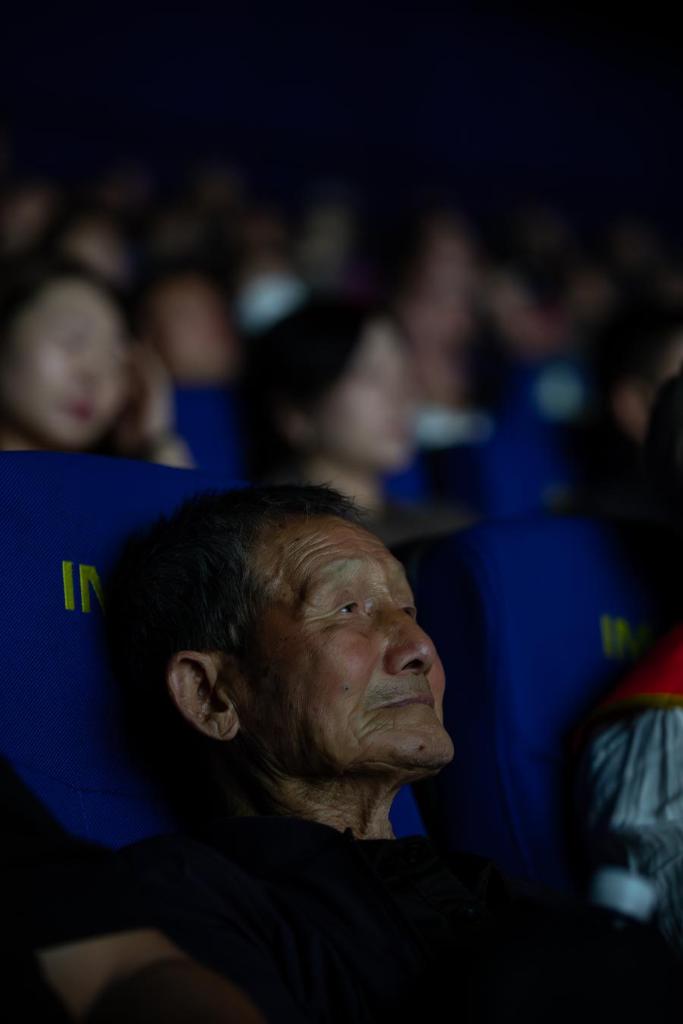 A family member of the victim watches the film Evil Unbound in Harbin, northeast China's Heilongjiang Province, Sept. 17, 2025. (Photo by Zhang Dawei/Xinhua)
