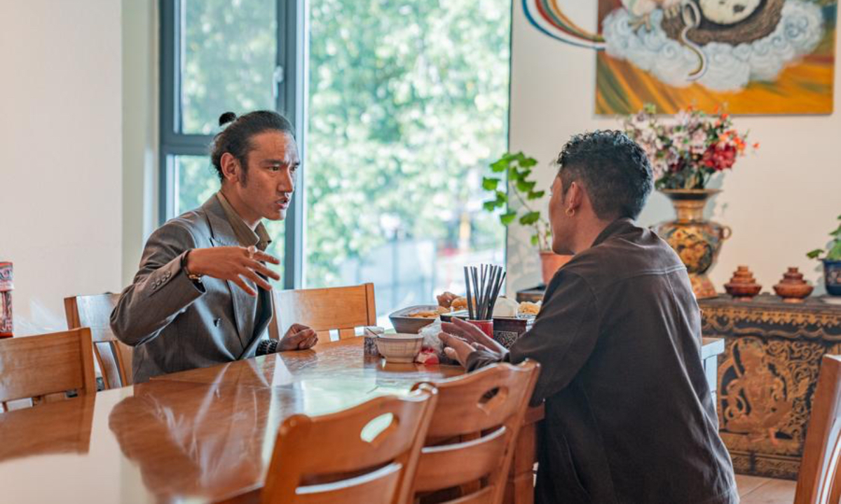 Tashi Badan (L) discusses the product design plan with a friend at Yakhore Design Company in Lhasa, southwest China's Xizang Autonomous Region, Sept. 16, 2025. (Xinhua/Tenzin Nyida)