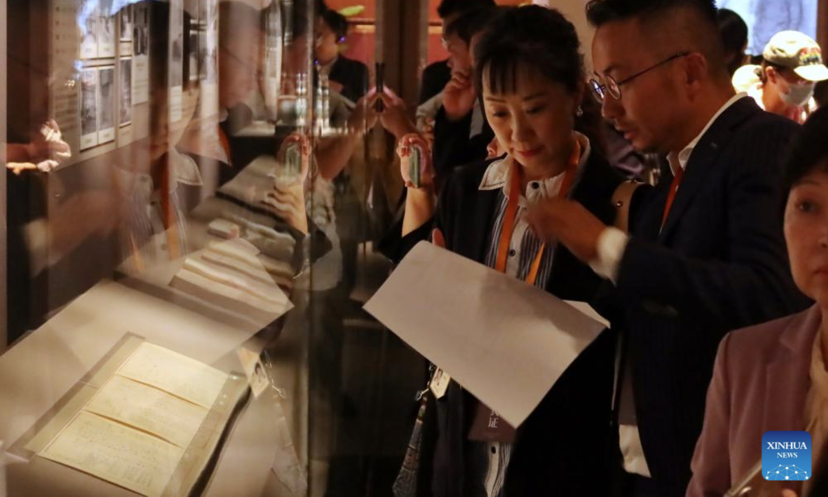People visit an exhibition commemorating the miraculous evacuation of the Palace Museum's collection during Chinese People's War of Resistance against Japanese Aggression more than 80 years ago, in Beijing, capital of China, Sept. 30, 2025. (Xinhua)