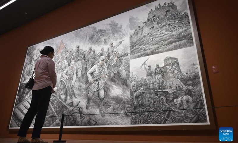 A visitor views a painting at the National Art Museum of China in Beijing, capital of China, Aug. 25, 2025.(Xinhua/Lu Peng)