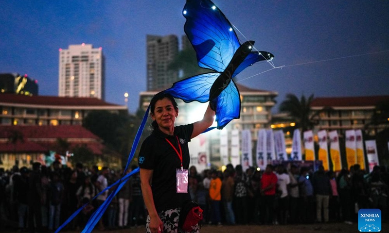 A participant flies an illuminated kite during the Colombo International Kite Festival in Colombo, Sri Lanka, Aug. 24, 2025. (Photo by Thilina Kaluthotage/Xinhua)