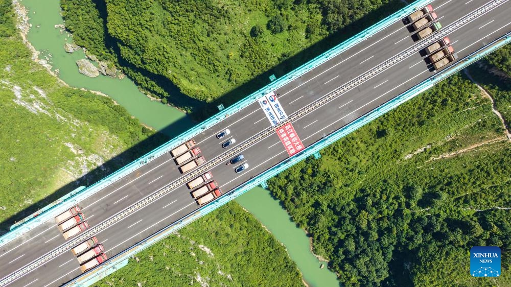 This aerial drone photo taken on Aug. 25, 2025 shows a load test on the Huajiang Grand Canyon Bridge in southwest China's Guizhou Province. (Photo by Chen Xi/Xinhua)
