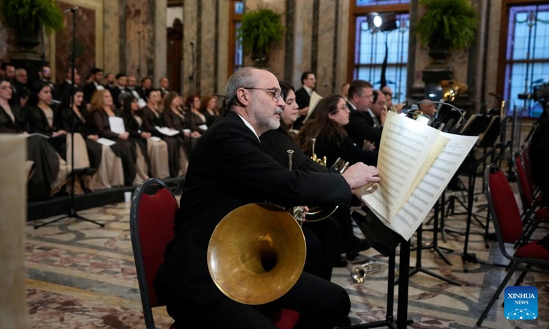 A member of Sodre Symphony Orchestra prepares to perform at the Legislative Palace during the concert of the bicentennial celebrations in Montevideo, Uruguay, on Aug. 25, 2025. Uruguay celebrated its 200th anniversary of the declaration of independence on Monday. (Photo by Nicolas Celaya/Xinhua)