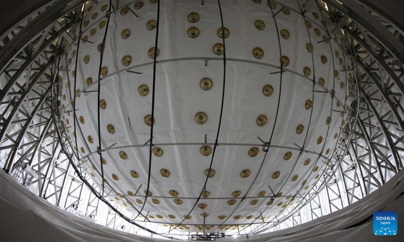 Researchers work at a control room of the Jiangmen Underground Neutrino Observatory (JUNO) in Jiangmen, south China's Guangdong This photo taken on Dec. 16, 2024 shows the central detector of the Jiangmen Underground Neutrino Observatory (JUNO) in Jiangmen, south China's Guangdong Province. (Xinhua/Jin Liwang)