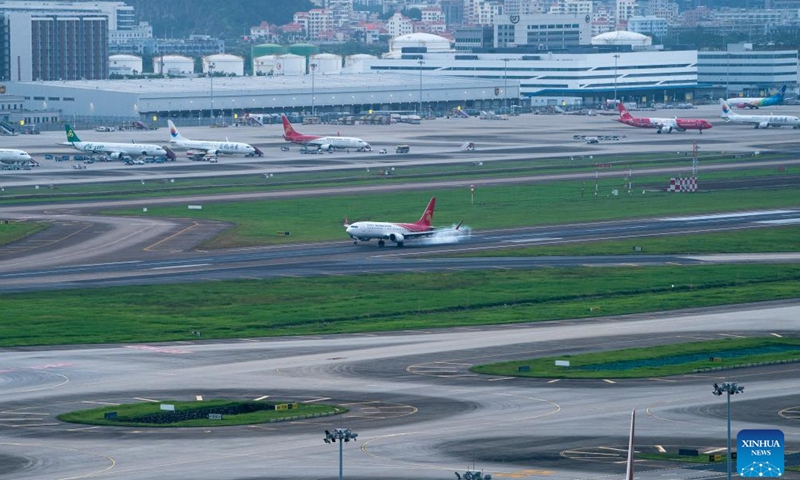 An aircraft of Shenzhen Airlines conducts a trial flight at the third runway of Shenzhen Bao'an International Airport in Shenzhen, south China's Guangdong Province, Aug. 26, 2025.