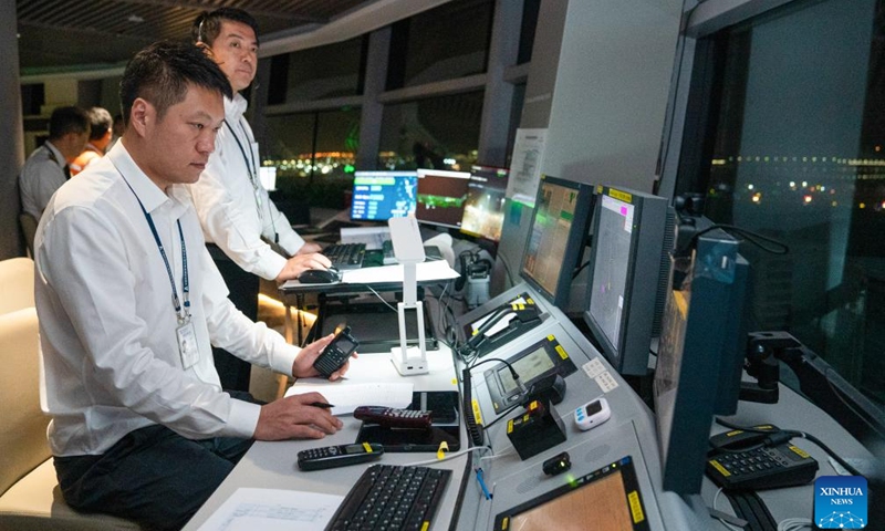 Air traffic controllers are pictured on duty during a trial flight at the third runway of Shenzhen Bao'an International Airport in Shenzhen, south China's Guangdong Province, Aug. 26, 2025.