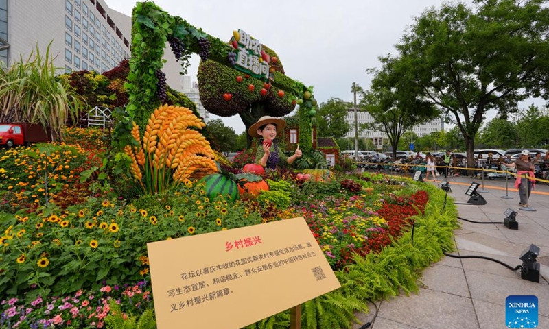 A set of floral installation is pictured at Xidan area in Beijing, capital of China, Aug. 26, 2025. Ten sets of floral installations along Chang'an Avenue marking the 80th anniversary of the victory in the Chinese People's War of Resistance Against Japanese Aggression and the World Anti-Fascist War have been completed. (Xinhua/Ju Huanzong)