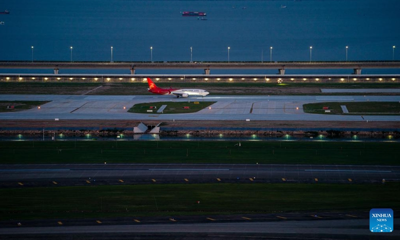 An aircraft of Shenzhen Airlines conducts a trial flight at the third runway of Shenzhen Bao'an International Airport in Shenzhen, south China's Guangdong Province, Aug. 26, 2025.