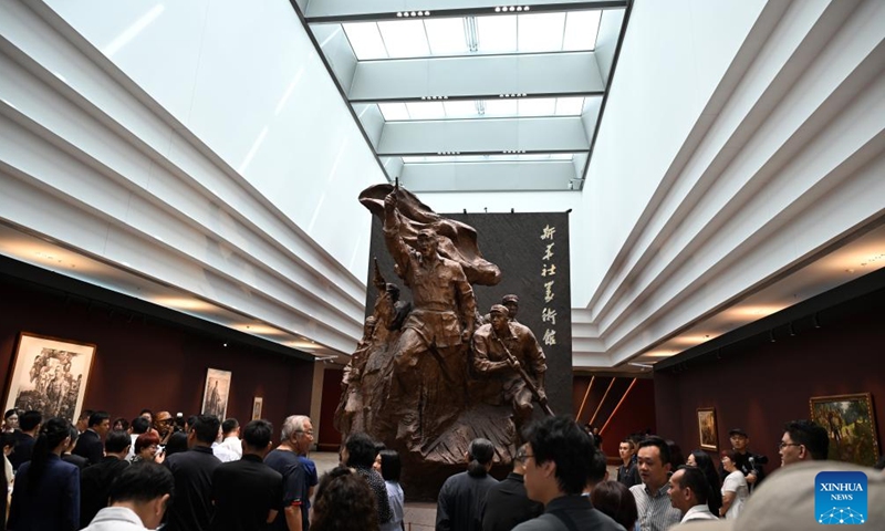 People visit an art exhibition highlighting the Chinese People's War of Resistance Against Japanese Aggression in Beijing, capital of China, Aug. 26, 2025. (Xinhua/Jin Liangkuai)