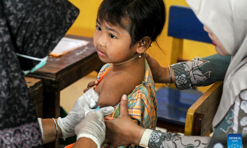 A girl receives a dose of measles vaccine in Sumenep Regency, East Java, Indonesia, on Aug. 27, 2025. Indonesia has recorded 46 measles cases across 42 districts and cities in 13 provinces, with Sumenep in East Java identified as the worst-affected area with 17 deaths, the Ministry of Health said on Tuesday. (Photo by Sahlan Kurniawan/Xinhua)