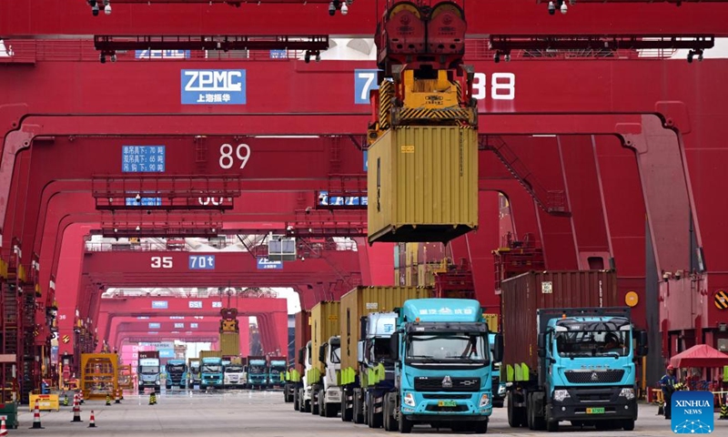 This photo taken on Aug. 26, 2025 shows trucks at a dock of Qingdao Port in Qingdao, east China's Shandong Province.(Xinhua/Li Ziheng)