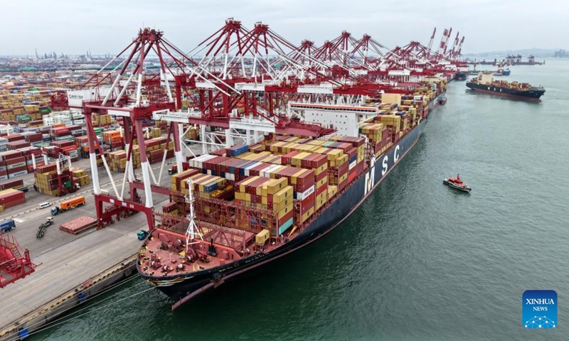 An aerial drone photo taken on Aug. 26, 2025 shows a cargo ship at Qingdao Port in Qingdao, east China's Shandong Province.(Xinhua/Li Ziheng)