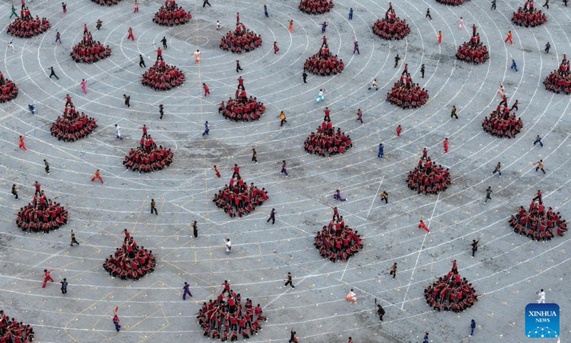 A dron photo taken on Aug. 27, 2025 shows the performance by students of Shaolin Tagou Martial Arts School during the celebration of the International Boxing Day held by the International Boxing Association (IBA) in Dengfeng, Zhengzhou, central China's Henan Province. (Xinhua/Li Jianan)