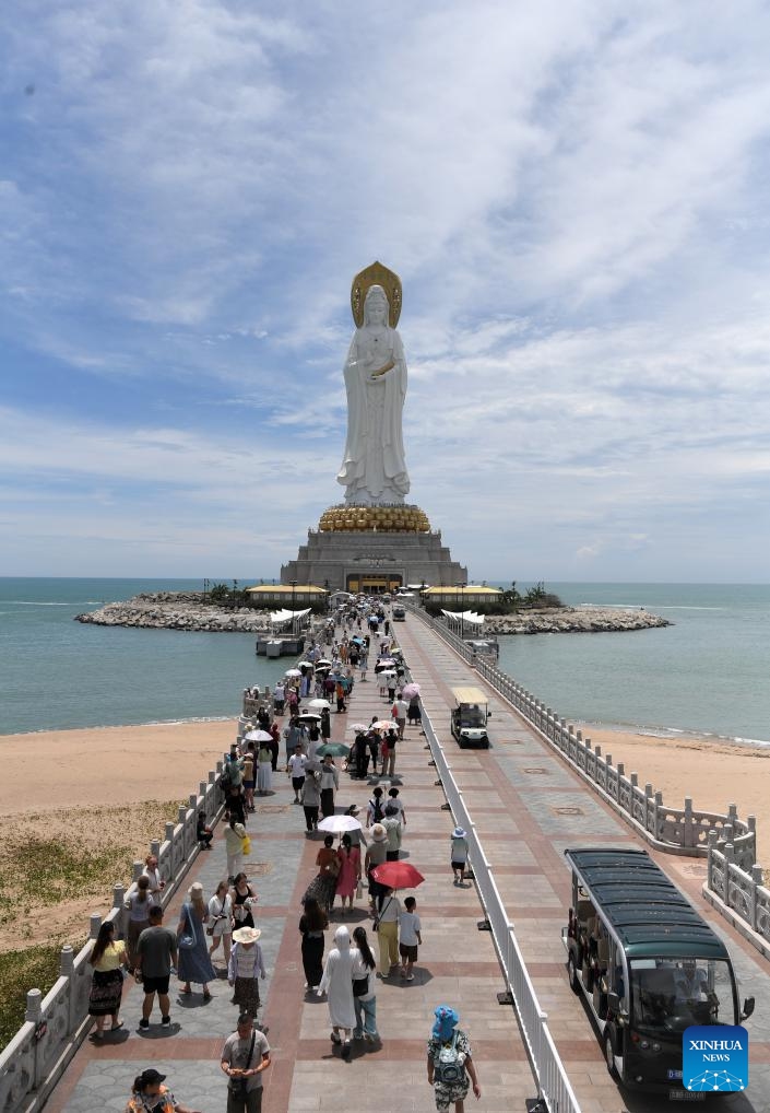 Tourists visit the Nanshan Cultural Tourism Zone in Sanya, south China's Hainan Province, Aug. 27, 2025. After Typhoon Kajiki swept through, Sanya City has been moving swiftly to restore its tourism market. (Xinhua/Zhao Yingquan)
