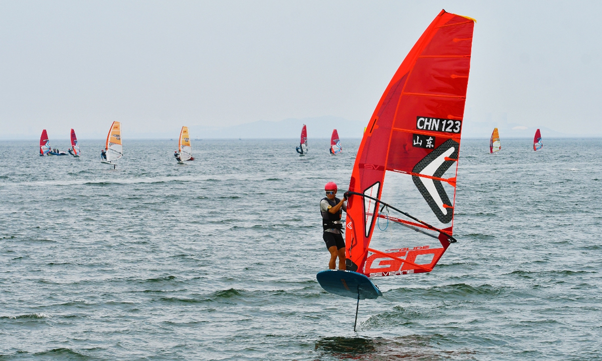 Participants compete in the National Windsurfing Championships in Yantai, East China's Shandong Province, on August 28, 2025. More than 200 athletes and coaches of 22 teams from 14 provinces and cities are competing in the event, which will conclude on Monday. Photo: VCG