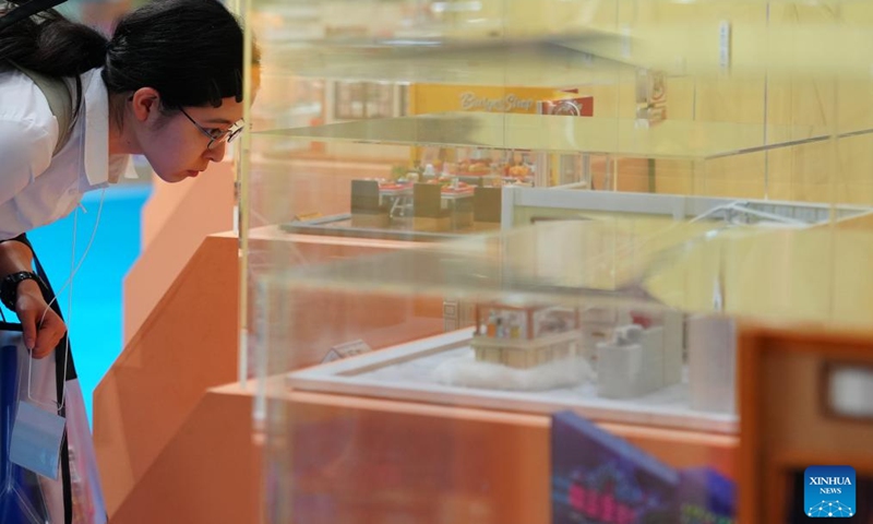 A visitor looks at toys exhibited at the International Tokyo Toy Show 2025 in Tokyo, Japan, Aug. 28, 2025. The toy show kicked off here on Thursday, attracting 210 exhibitors with around 35,000 items on display. Photo: Xinhua