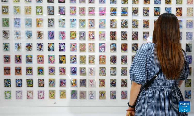 A visitor looks at cards exhibited at the International Tokyo Toy Show 2025 in Tokyo, Japan, Aug. 28, 2025. The toy show kicked off here on Thursday, attracting 210 exhibitors with around 35,000 items on display. Photo: Xinhua