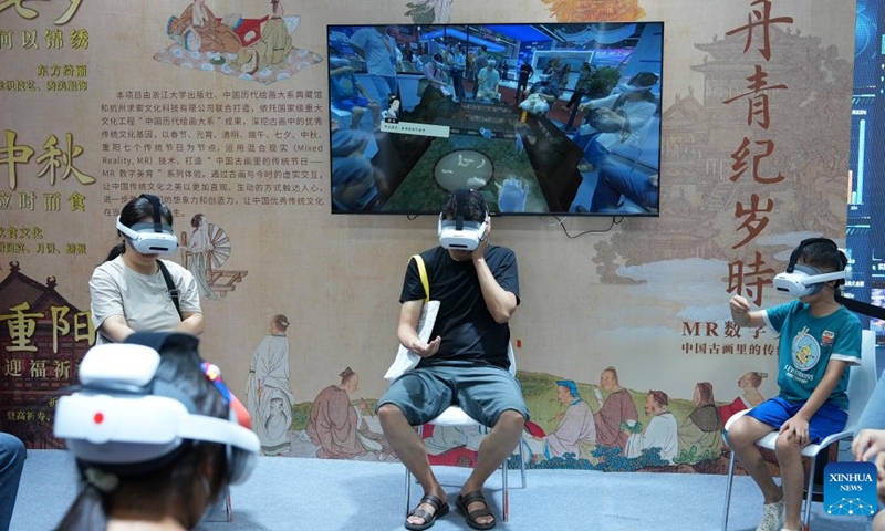 Visitors try MR devices during the 15th China International Digital Publishing Expo in Zhengzhou, central China's Henan Province, Aug. 28, 2025. Themed Achieving a Smart Future Through Digital-Real Convergence, the 15th China International Digital Publishing Expo kicked off in Zhengzhou on Thursday. Photo: Xinhua