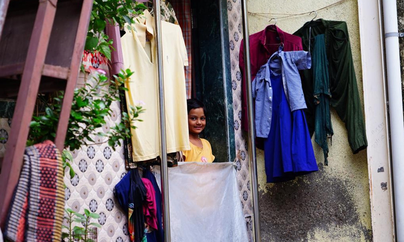 This photo taken on Aug. 24, 2025 shows a girl at Dharavi slum, in Mumbai, India. India boasts a diverse and rich culture, attracting global attention with its historical heritage, Bollywood film industry, yoga culture, and more. Photo: Xinhua