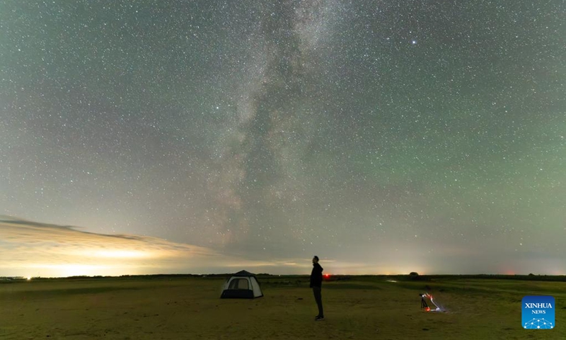People view the Milky Way and the Altair and Vega stars on opposite sides in Huachuan County of Jiamusi City, northeast China's Heilongjiang Province, on Aug. 21, 2025. Known as the Chinese version of the Valentine's Day, the Qixi Festival fell on Friday this year. Photo: Xinhua