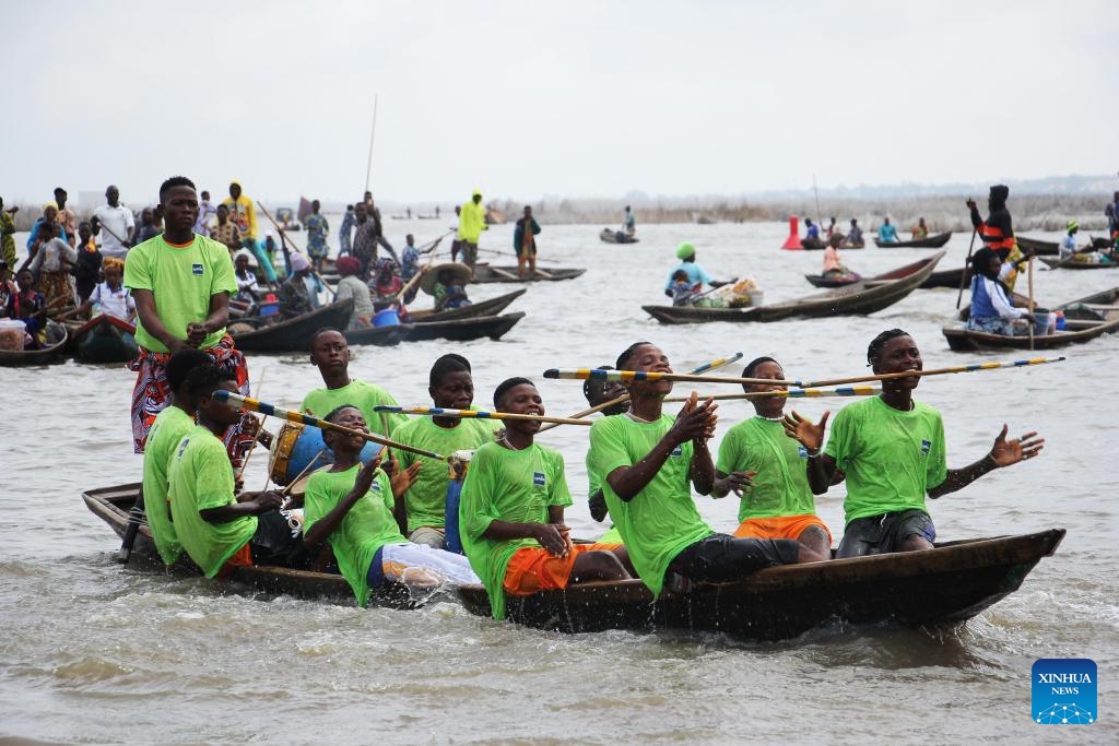 People perform a dance on a canoe during a festival of water sports, culture and arts in Ganvie, near Cotonou, Benin, Aug. 30, 2025. (Photo: Xinhua)