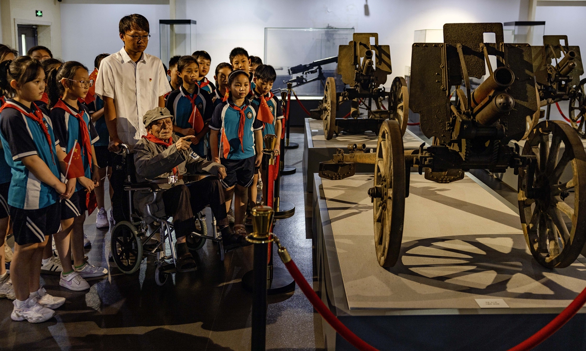 Primary school students in Taixing, East China's Jiangsu Province, kick off the new semester with a special first lesson at the memorial hall of the Huangqiao Campaign of the New Fourth Army on August 31, 2025. They listen to 101-year-old veteran Wu Liangjin share firsthand experiences from the historic battle. Photo: VCG