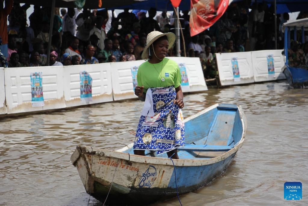 A young girl participates in a canoe dance competition during a festival of water sports, culture and arts in Ganvie, near Cotonou, Benin, Aug. 30, 2025. (Photo: Xinhua)